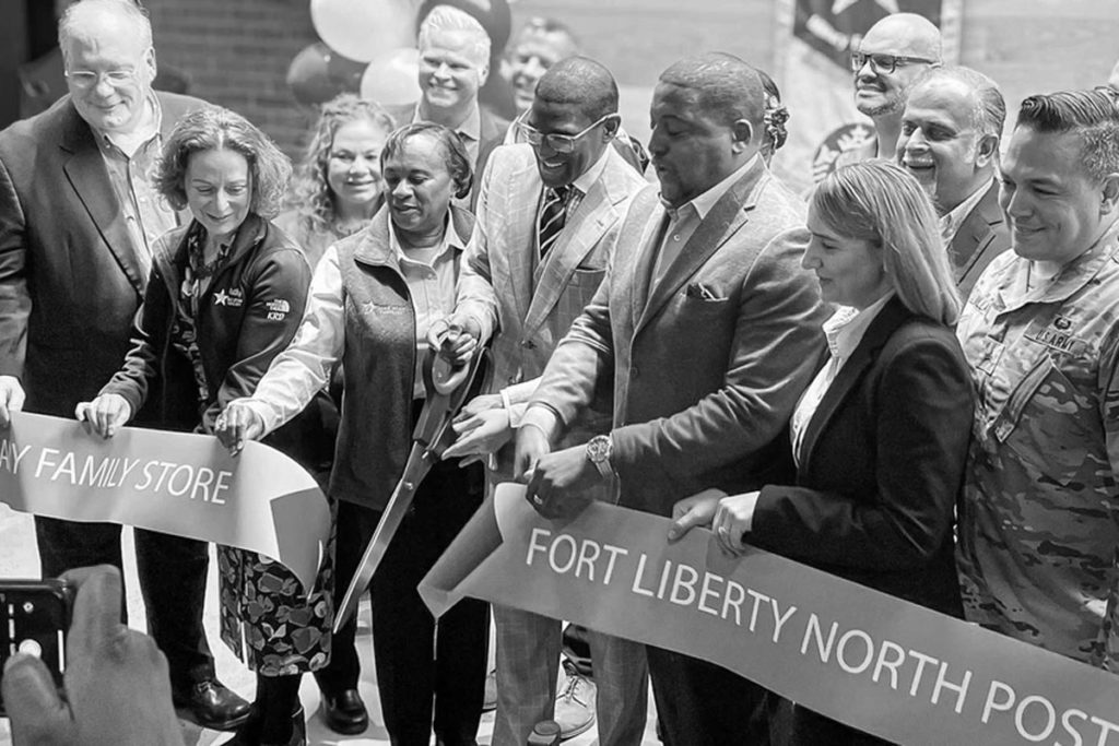 kathy roth-douquet and others cutting the tape at fort liberty starbucks