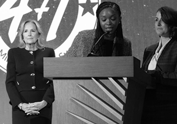 first lady doctor jill biden standing beside military spouse speaking at 4+1 event